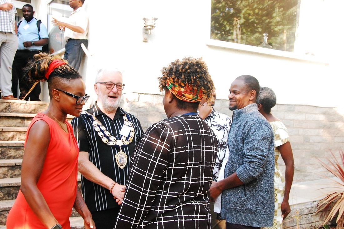 Guests in conversation with the Mayor of Weston-super-Mare, who is wearing the chain of office.