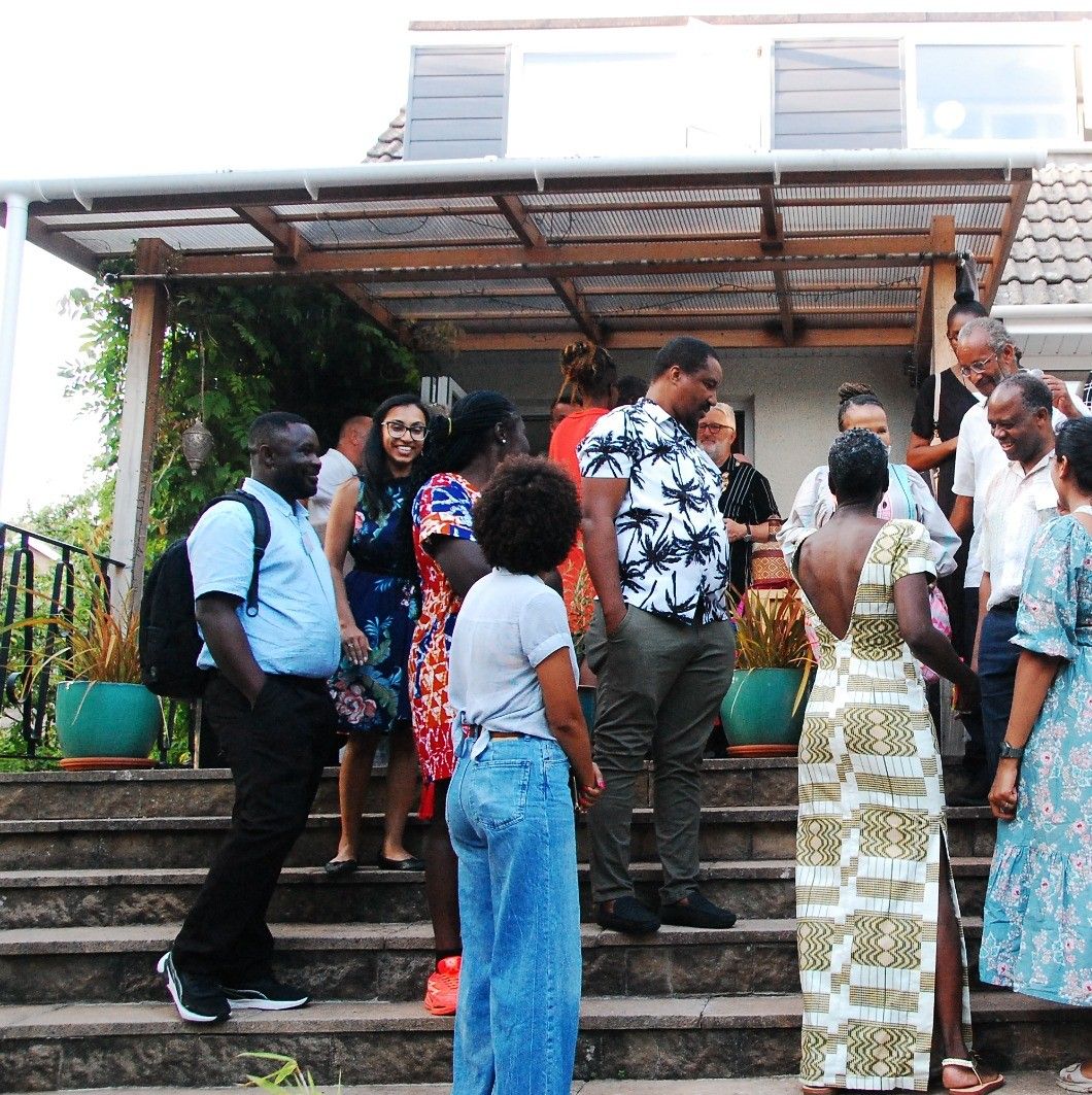 Guests talking together on the steps outside the venue at the BPNS launch.